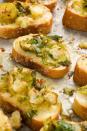 <p>Shredded Brussels sprouts sautéed in a mixture of garlic and chilli flakes, then topped on toasts with white cheddar will leave you saying "Insane!" in the best way.</p><p>Get the <a href="https://www.delish.com/uk/cooking/recipes/a33664233/cheesy-brussels-sprouts-mini-toasts-recipe/" rel="nofollow noopener" target="_blank" data-ylk="slk:Cheesy Brussels Sprouts Mini Toasts;elm:context_link;itc:0;sec:content-canvas" class="link ">Cheesy Brussels Sprouts Mini Toasts</a> recipe.</p>
