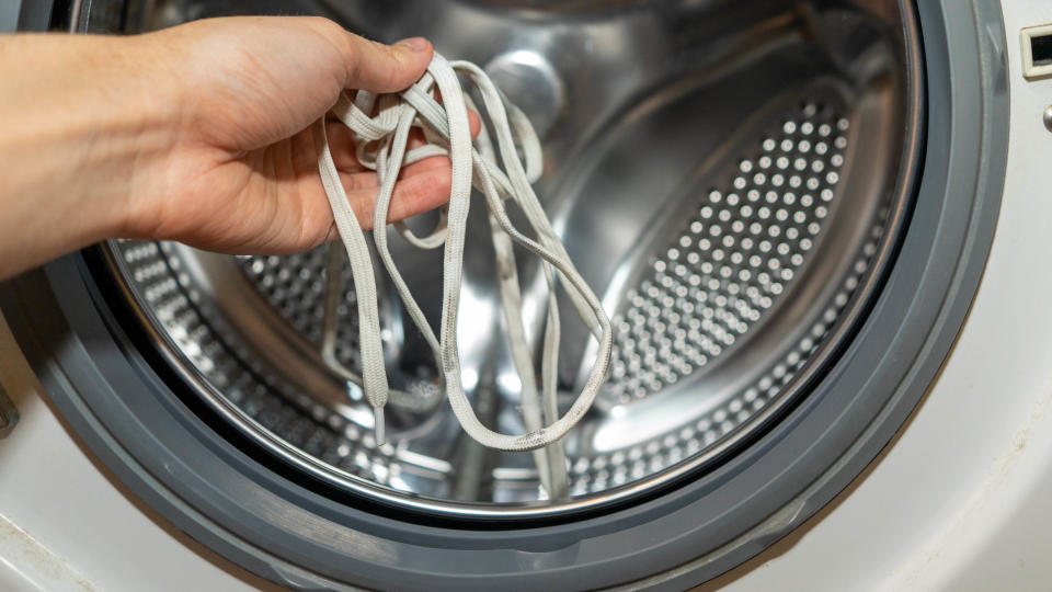 Putting laces into washing machine