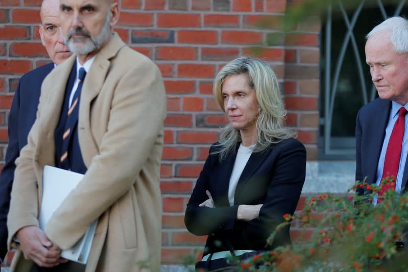 Jane Buckingham walks in to the federal courthouse for her sentencing hearing in Boston