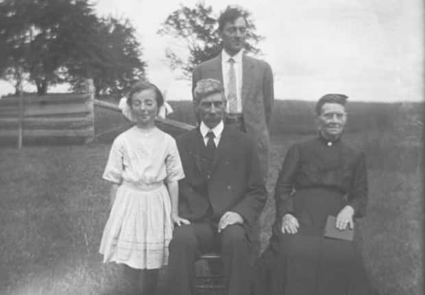 A young Hope Ives, left, poses with her father and grandparents, in this family photo taken some time between 1905 to 1920 in Tryon, P.E.I.  (PARO - image credit)