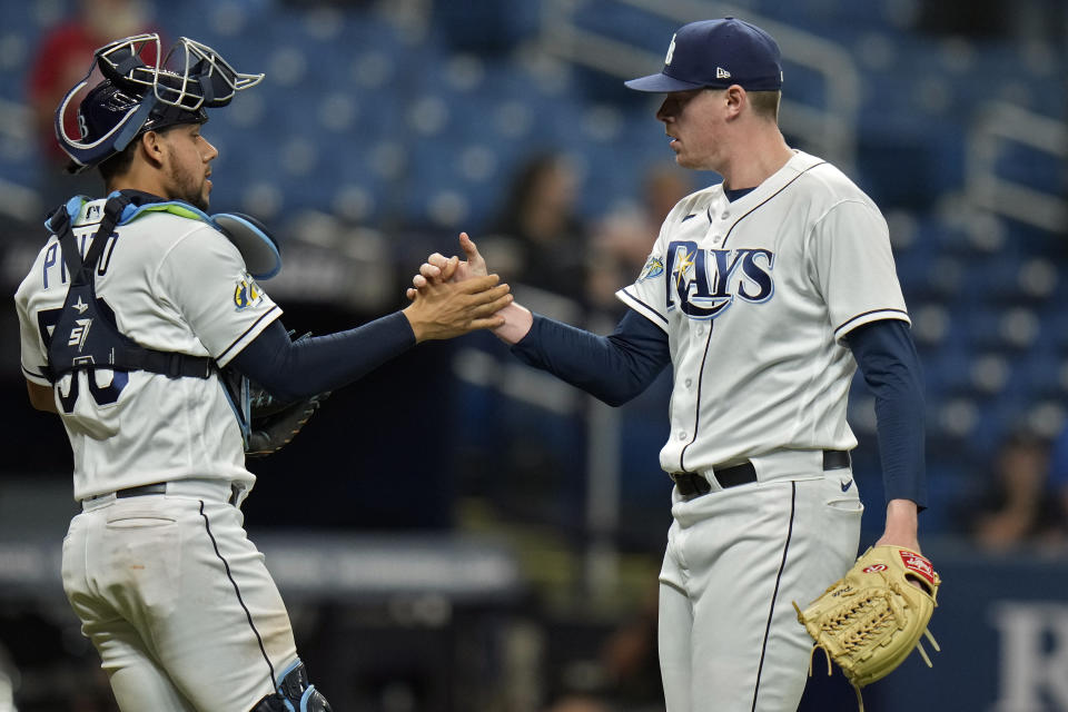 Tampa Bay Rays relief pitcher Pete Fairbanks celebrates with catcher Rene Pinto, left, after closing out the Colorado Rockies during the ninth inning of a baseball game Thursday, Aug. 24, 2023, in St. Petersburg, Fla. (AP Photo/Chris O'Meara)