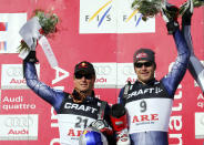 FILE - Bode Miller of the United States, right, winner of a World Cup Men's super-G, celebrates on the podium with second placed fellow countryman Daron Rahlves, at the World Cup finals, in Are, Sweden, Thursday, March,16, 2006. Mikaela Shiffrin's record 83rd World Cup victory Tuesday, Jan. 24, 2023 is only the latest exploit by an American team that has been producing success after success on the circuit since Daron Rahlves and Bode Miller started it all off more than 20 years ago. (AP Photo/Alessandro Trovati, File)