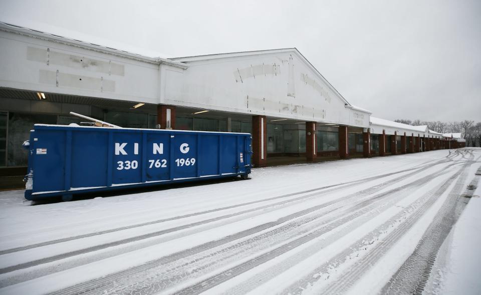 An industrial sized dumpster sits in front of the former High Point Furniture store at the Midway Plaza on Wednesday in Tallmadge.