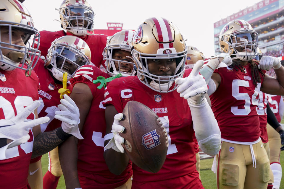 San Francisco 49ers cornerback Jimmie Ward (1) celebrates his interception with teammates in the second half of an NFL football game against the Washington Commanders, Saturday, Dec. 24, 2022, in Santa Clara, Calif. (AP Photo/Godofredo A. Vásquez)