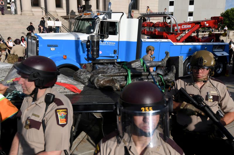 Demonstrators pulled down the statue of Christopher Columbus from the Minnesota State Capitol grounds