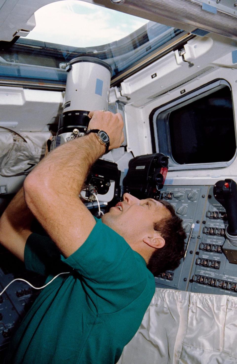 David Hilmers takes Earth imagery from the Flight Deck of Space Shuttle Atlantis during STS-36.