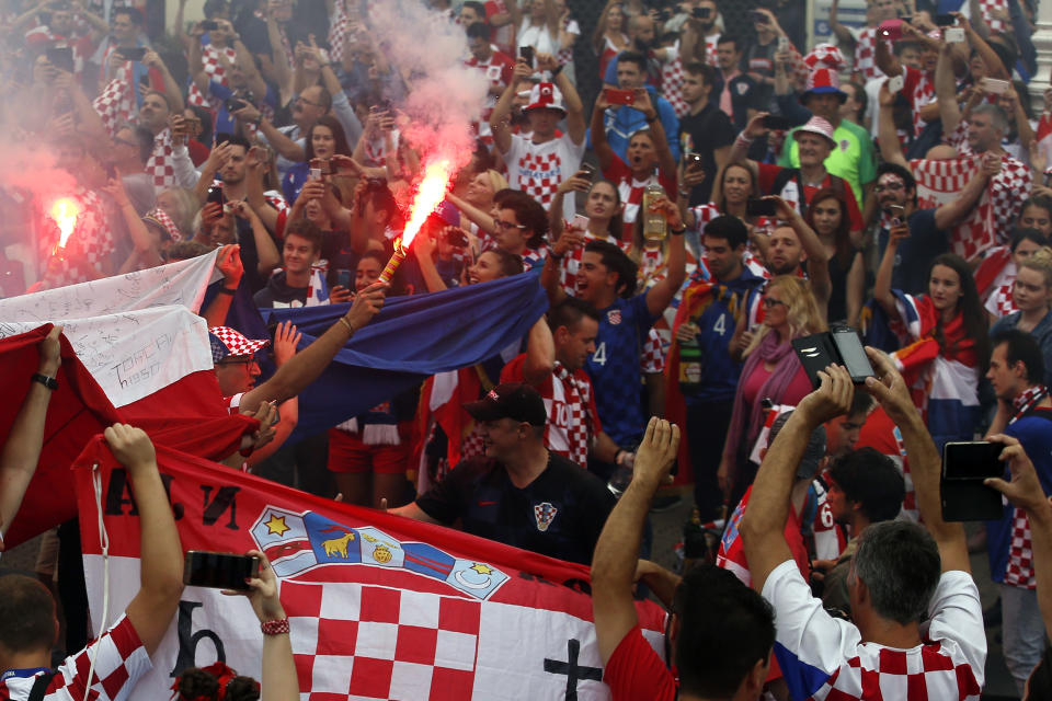 <p>Croatia soccer fans shout chants and cheer prior to a television broadcast of the Russia 2018 World Cup match between France and Croatia in downtown Zagreb, Croatia, Sunday, July 15, 2018. (AP Photo/Darko Vojinovic) </p>