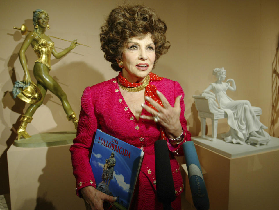 FILE - Italian actress Gina Lollobrigida speaks at the media viewing of the first exhibition of her sculptures at Moscow's Pushkin Museum of Fine Arts, on June 23, 2003. Gina Lollobrigida, the Italian actress, photographer and sculptor who was dubbed "the most beautiful woman in the world" after the title of one her movies, has died in Rome. (AP Photo/ Alexander Zemlianichenko, File)