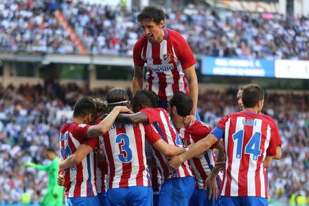 Football Soccer - Real Madrid v Atletico Madrid - Spanish La Liga Santander - Santiago Bernabeu Stadium, Madrid, Spain - 8/04/17 - Atletico Madrid's players celebrates a goal. REUTERS/Juan Medina