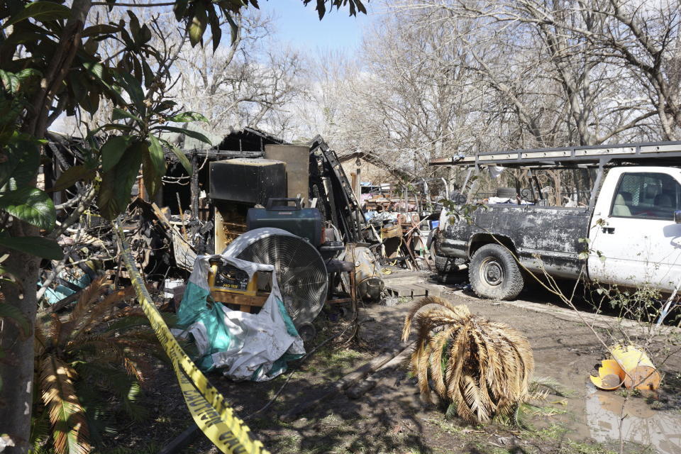 Damage is seen after a deadly house fire on Feb. 3, 2024, in Houston. A Texas mother and her 1-year-old son died after a fire engulfed their Houston home, but not before she was able to rescue her two other children, according to authorities. (Hana Ikramuddin/Houston Chronicle via AP)