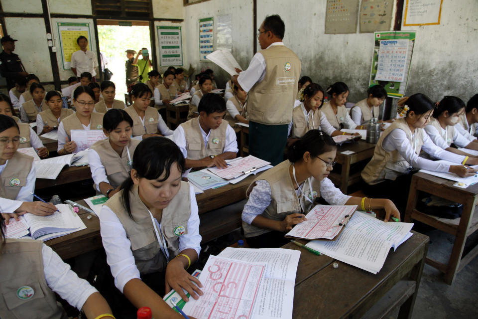 In this photo taken on March 20, 2014, teachers of basic education receive a training for nationwide census at a school in Kyaung Gone township, Ayeyarwaddy Delta, Myanmar. As Myanmar continues its transition from decades of military rule and self-imposed isolation, it is about to carry out a census that experts say is crucial for national planning and development, but also likely to inflame already soaring ethnic and religious tensions. (AP Photo/Khin Maung Win)