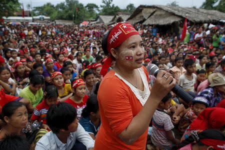 A supporter asks Myanmar pro-democracy leader Aung San Suu Kyi a question during Suu Kyi's campaign in her constituency of Kawhmu township, outside Yangon September 21, 2015. REUTERS/Soe Zeya Tun