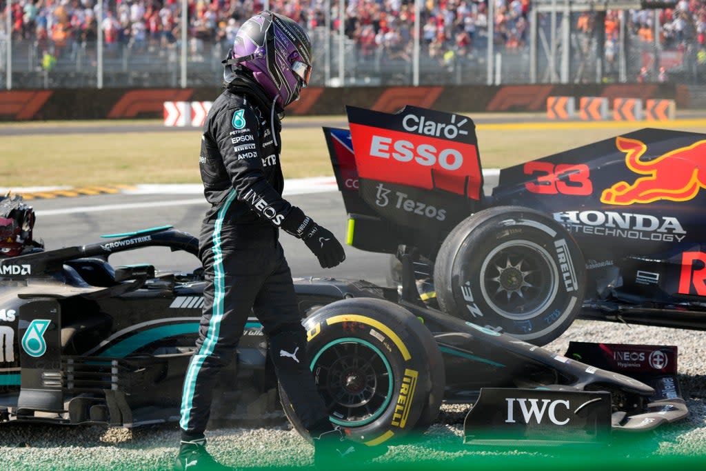 Lewis Hamilton walks away from his Mercedes after colliding with Max Verstappen (Luca Bruno/AP) (AP)