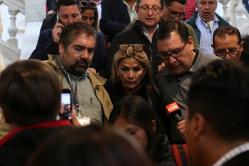 Bolivian opposition leader and senator Jeanine Anez Chavez speaks to the media as she leaves the Congress building in La Paz