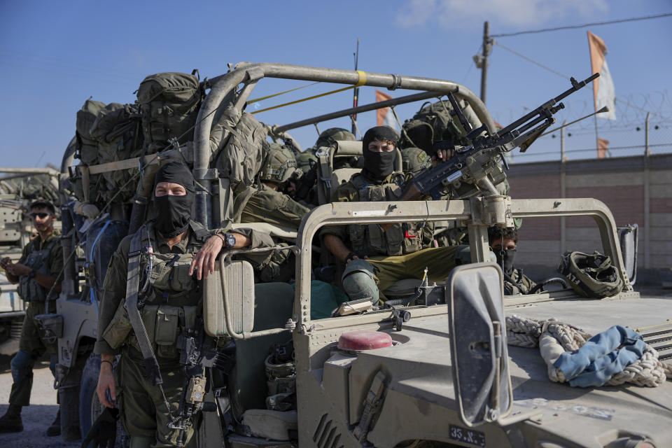 Israeli army troops are seen on the Israeli-Gaza border during a ground operation in the Gaza Strip, Wednesday, Nov. 8, 2023. Israeli ground forces entered the Gaza Strip as they press ahead with their war against Hamas militants in retaliation for the group's unprecedented Oct. 7 attack on Israel. (AP Photo/Ohad Zwigenberg)