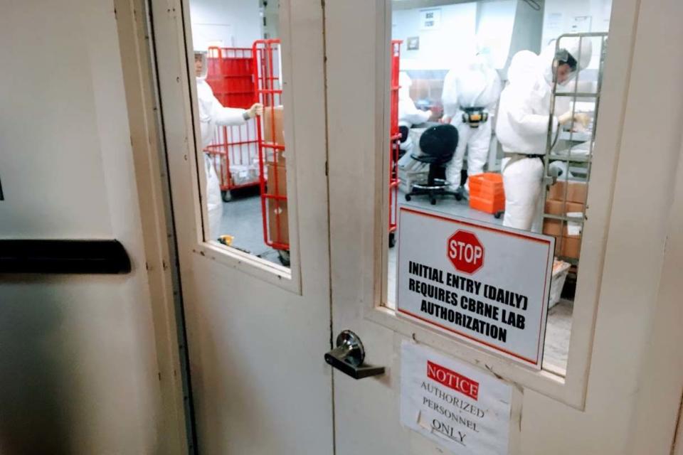 Staff screen mail as it arrives at a government facility in Washington DC (AFP via Getty Images)