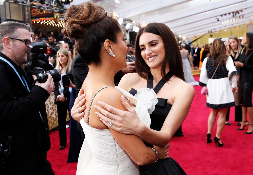 Penelope Cruz talks with Salma Hayek on the red carpet during the Oscars arrivals at the 92nd Academy Awards in Hollywood, Los Angeles, California, U.S., February 9, 2020. REUTERS/Mike Blake