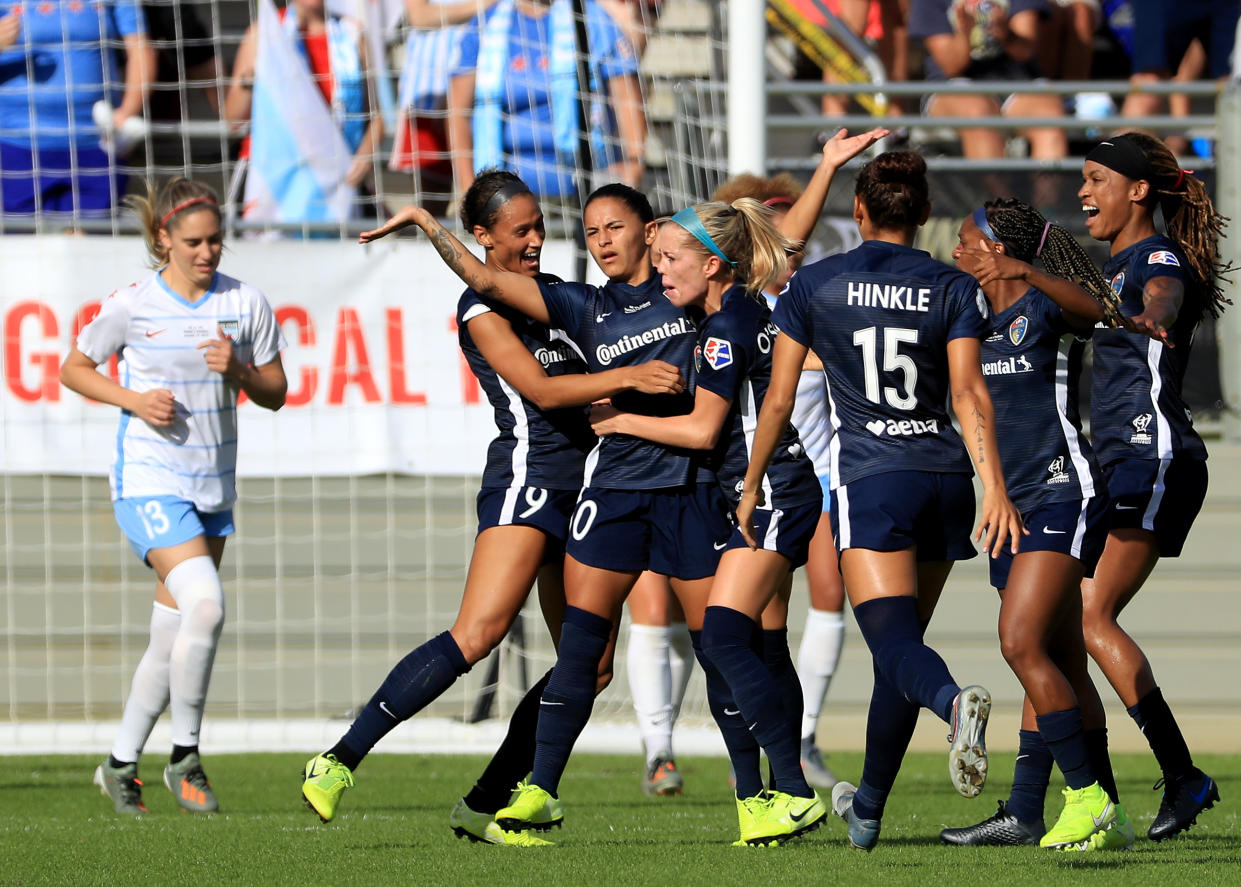 Debinha (center) celebrates after scoring the opening goal in the North Carolina Courage's 4-0 victory over the Chicago Red Stars in the NWSL Championship on Sunday. (Getty)