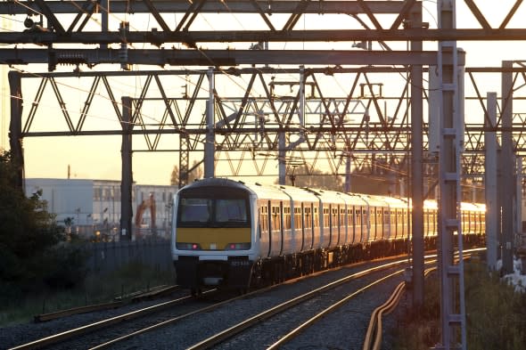 Rail Commuters As U.K. Government Caps Train Fare Increases