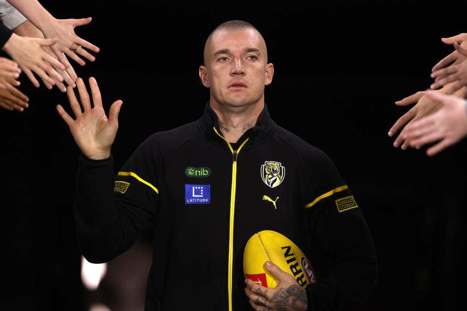 MELBOURNE, AUSTRALIA - MAY 11:  Dustin Martin of the Tigers runs out to warm up before  the round nine AFL match between Richmond Tigers and Western Bulldogs at Melbourne Cricket Ground, on May 11, 2024, in Melbourne, Australia. (Photo by Darrian Traynor/AFL Photos/via Getty Images)