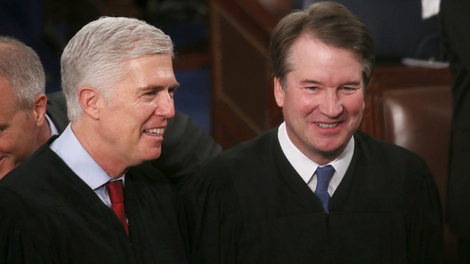 Supreme Court Justices Neil Gorsuch, left, and Brett Kavanaugh attend the State of the Union address in the U.S. House of Representatives in February 2020.