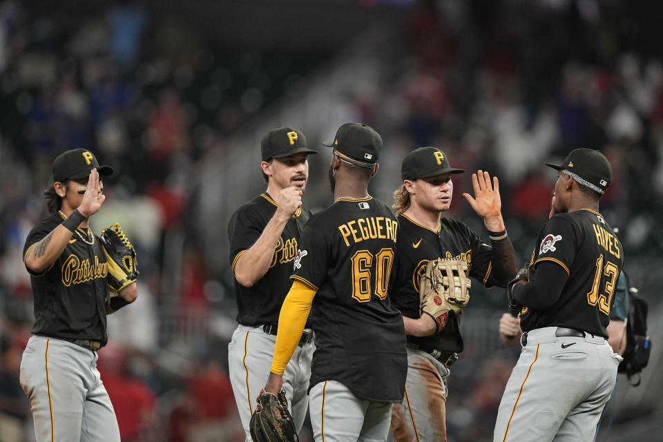 Pittsburgh Pirates celebrate a win against the Atlanta Braves, Saturday, Sept. 9, 2023, in Atlanta. (AP Photo/Brynn Anderson)