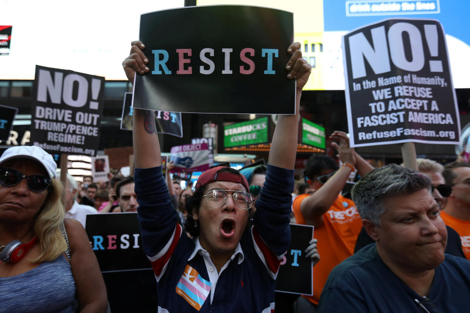 People protest U.S. President Donald Trump's announcement that he plans to reinstate a ban on transgender individuals from serving in any capacity in the U.S. military, in Times Square, in New York City, New York, U.S., July 26, 2017. REUTERS/Carlo Allegri