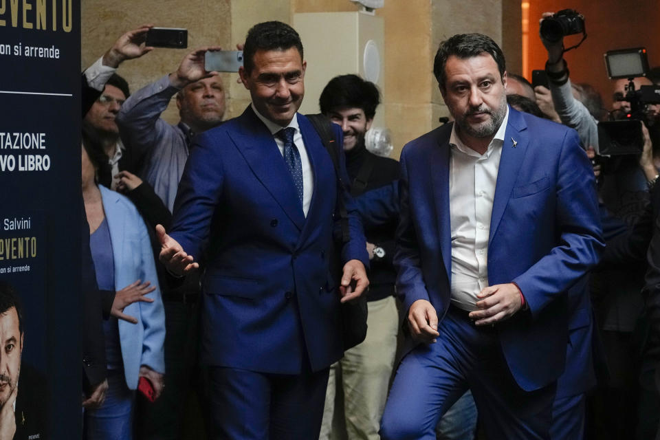 The League leader Matteo Salvini, right, arrives to his book presentation flanked by General Roberto Vannacci, one of the League candidates at the next European Parliament election, in Rome, Tuesday, April 30, 2024. (AP Photo/Alessandra Tarantino)
