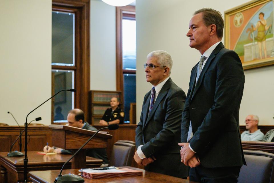William G. Timberlake, right, appears with his attorney, Peter T. Cahoon for arraignment on charges related to engaging in a pattern of corrupt activity, among others, before Judge Elizabeth Lehigh Thomakos in the Tuscarawas County Court of Common Pleas.