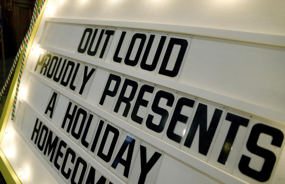 A sign at a Colorado Springs, Colo., church on Wednesday, Nov. 30, 2022, advertises an upcoming Christmas program put on by the Out Loud Colorado Springs Men's Chorus. The group has taken an active role in the healing process after a Nov. 19 attack killed five people at an LGBTQ nightclub in Colorado Springs. (AP Photo/Thomas Peipert)