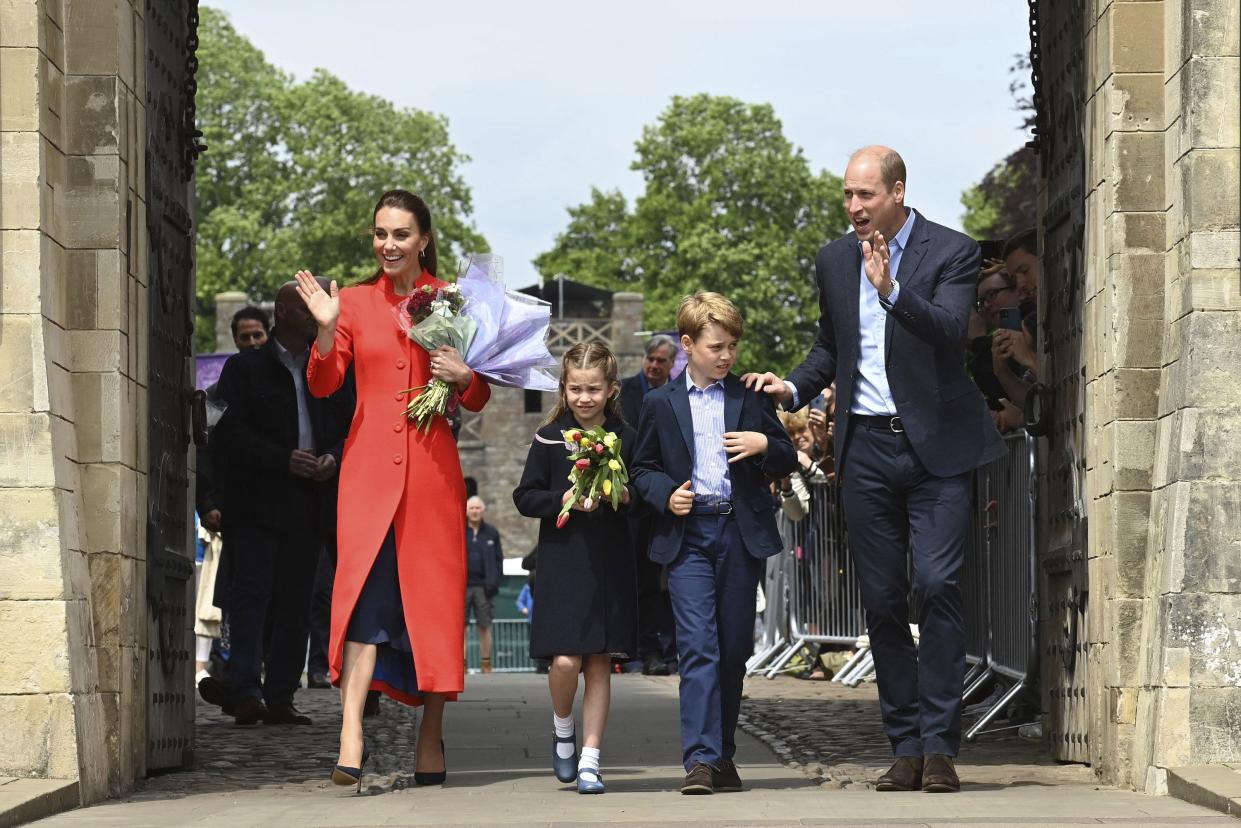 Britain's Kate, Duchess of Cambridge, Princess Charlotte, Prince George and Prince William wave during their visit to Cardiff Castle to meet performers and crew involved in the special Platinum Jubilee Celebration Concert taking place in the castle grounds later in the afternoon, Saturday June 4, 2022.