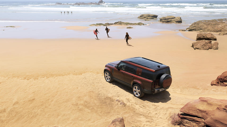 The 2023 Land Rover Defender 130 parked on a beach