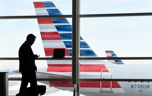 American is automatically rebooking passengers on other flights and seeking volunteers in advance on packed flights to free up space for potential rebookings as needed.