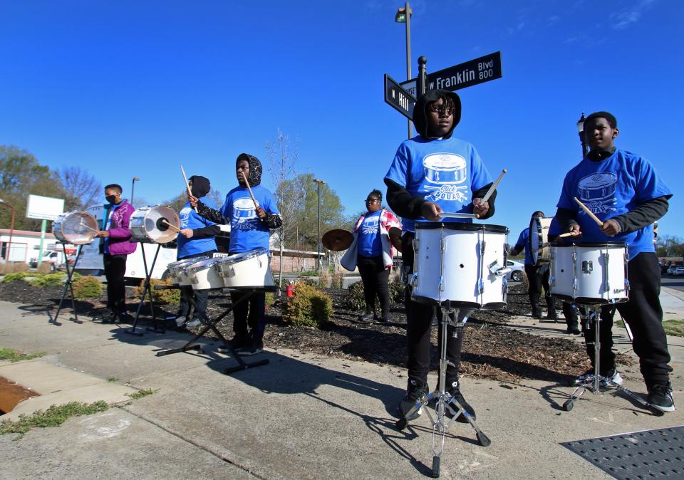 Members of the Boys & Girls Clubs of Greater Gaston Stick Squad play for the runners and walkers during the Gaston Community Foundation 5K Run early Saturday morning, April 9, 2022, outside CaroMont Health Park.