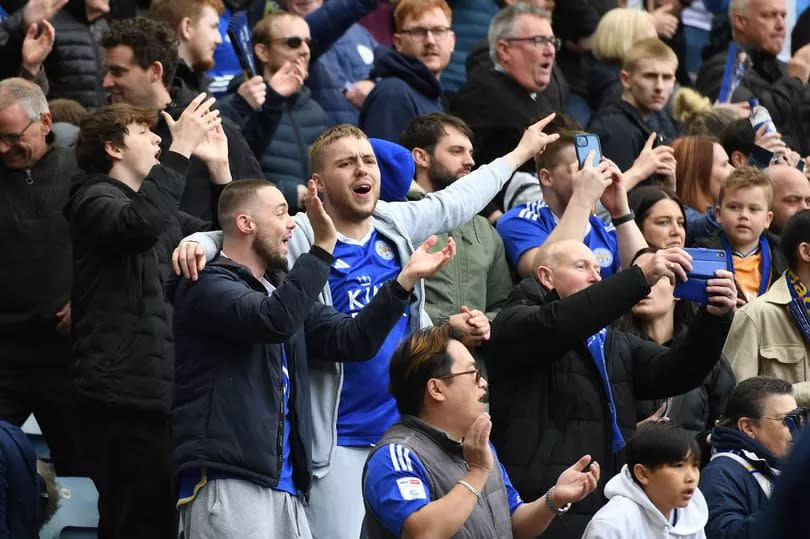 Leicester City fans celebrate the 2-1 victory over West Brom at the King Power Stadium