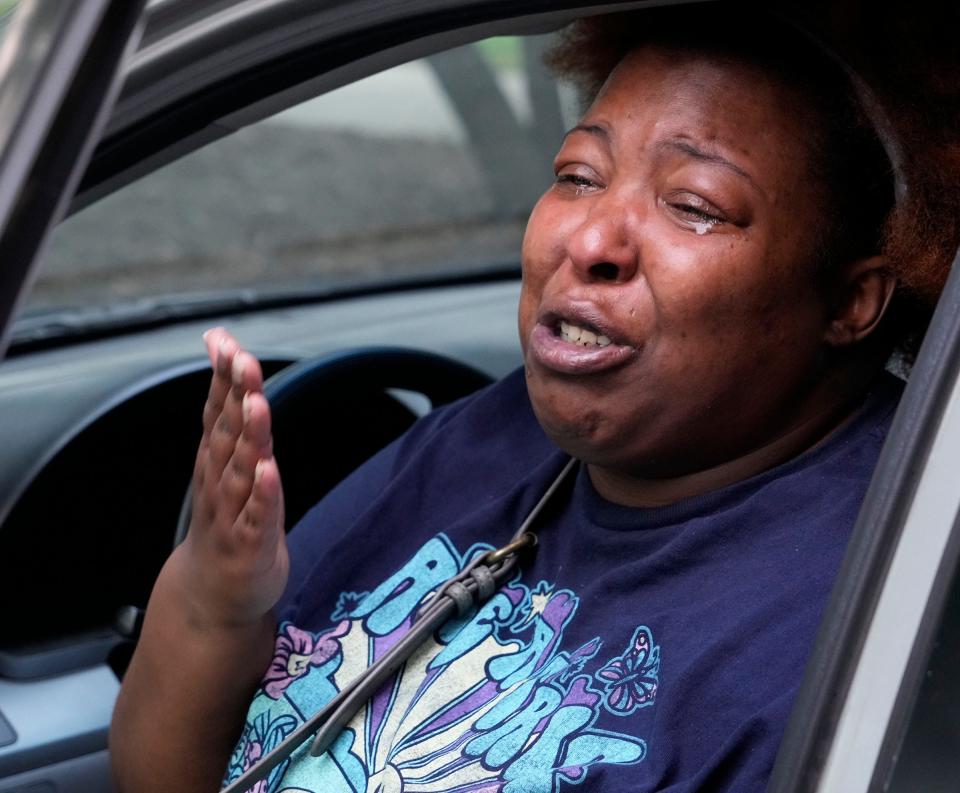 Breana Weakley tears up while talking about the toll of having to move multiple times since being displaced. She spoke after a meeting with other tenants of Community within the Corridor residents at the office of the landlord's office on North 27th Street in Milwaukee on Wednesday, June 14, 2023. Forced to evacuate three months ago over the presence of dangerous vapors, another resident of the affordable housing complex is now taking the landlord to court.