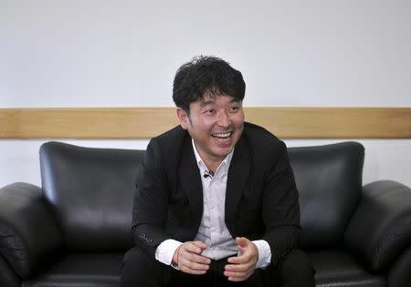 Naomi Ishii, Managing Director of Toyota Kirloskar Motor, laughs during an interview with Reuters inside his office in Bengaluru, November 7, 2015. REUTERS/Abhishek N. Chinnappa