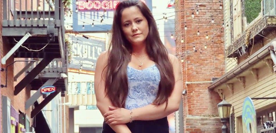 Jenelle Evans poses near brick buildings