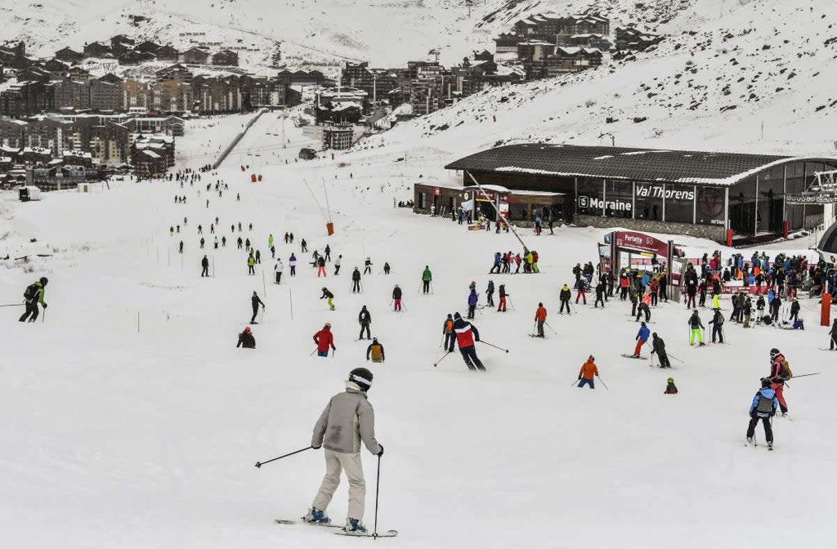 Skiers ride down a slope at Val Thorens, in the French Alps (AFP via Getty Images)