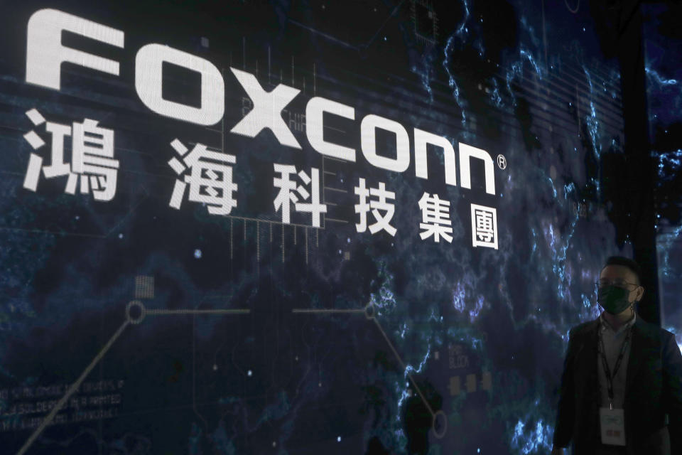 FILE - The Foxconn logo is seen during the Hon Hai Tech Day in Taipei, Taiwan, on Oct. 18, 2022. Foxconn, the company that assembles Apple Inc.’s iPhones, has announced it is easing COVID-19 restrictions at its largest factory, in Zhengzhou, central China, that led thousands of workers to quit and drastically slowed production. (AP Photo/Chiang Ying-ying, File)