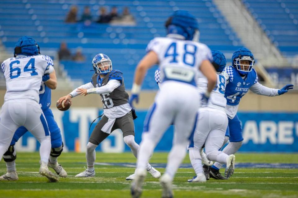 Kentucky backup quarterback Deuce Hogan (16) passes the ball during the Blue-White Spring Game at Kroger Field on Saturday.