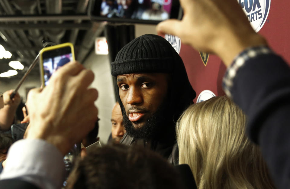 Cavaliers superstar LeBron James talks to reporters. (AP)