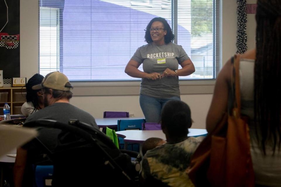 Ronica McQueen welcomes students and parents into her classroom at Rocketship Dennis Dunkins Elementary in Fort Worth, Texas, on Saturday, Aug. 6, 2022. The new charter school held a community kick-off event the weekend before school began Monday.