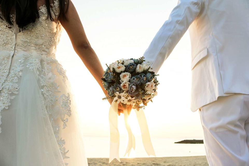 <p>Getty</p> Stock image of a bride and groom