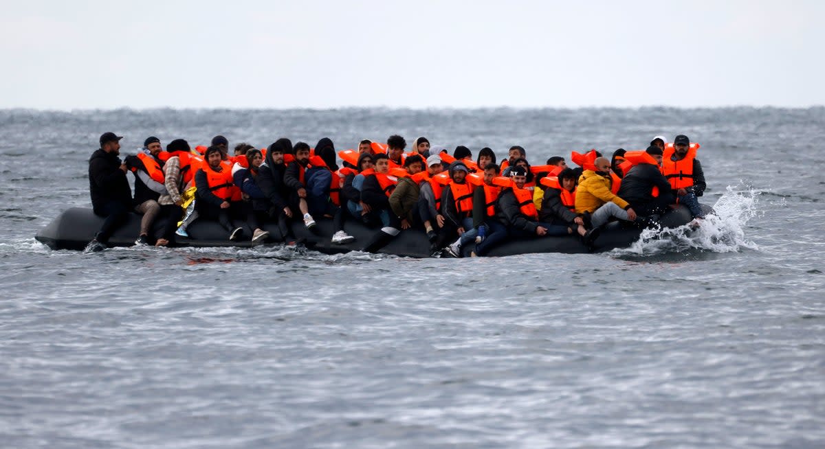 A dinghy overloaded with migrants pictured on Tuesday morning (STEVE FINN PHOTOGRAPHY for dailymail.co.uk)
