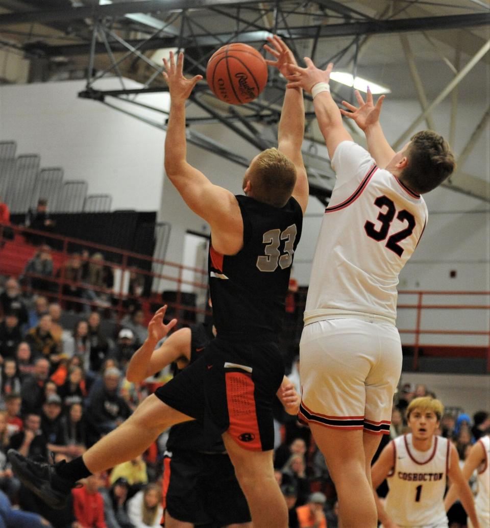 Ridgewood's Kauelen Smith and Coshocton's Hudson Wesney battle for a rebound during a recent game. Smith will return for the Generals this year. He averaged 6 points and 5 rebounds per game last season for Ridgewood.