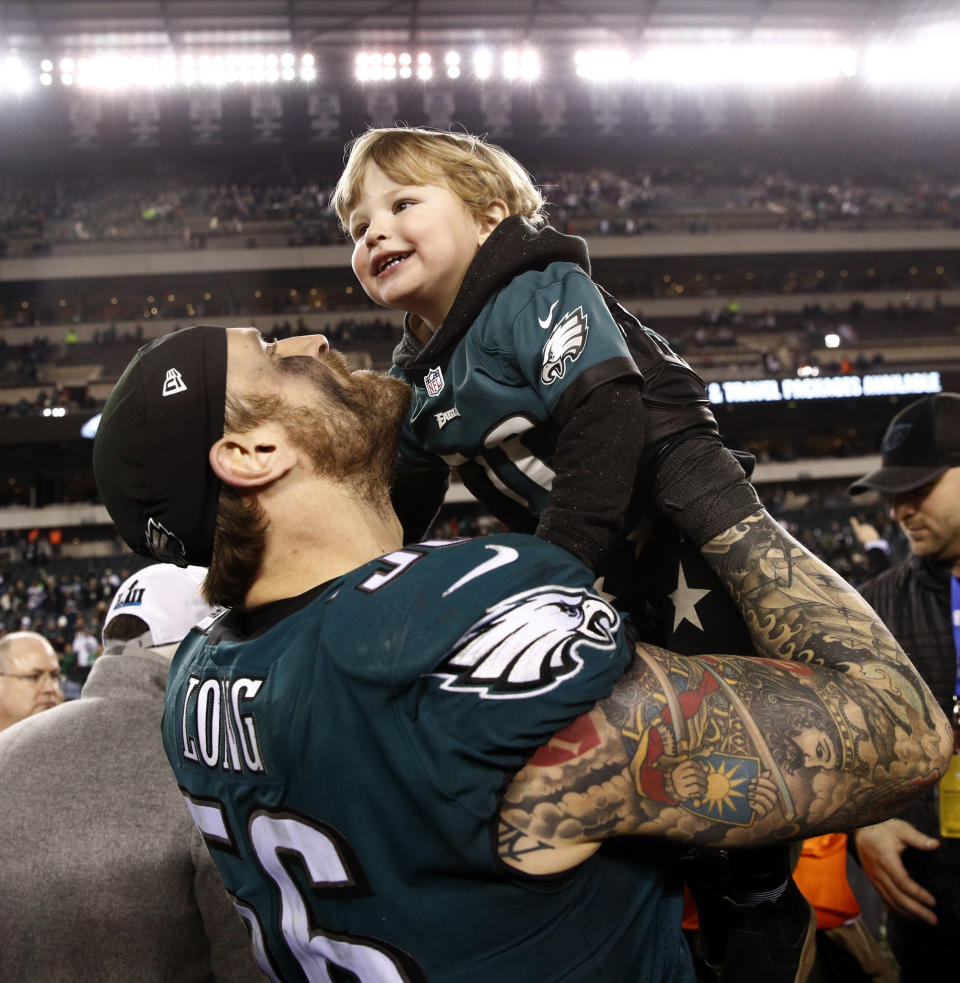 <p>Philadelphia Eagles’ Chris Long celebrates with his family after the NFL football NFC championship game against the Minnesota Vikings Sunday, Jan. 21, 2018, in Philadelphia. The Eagles won 38-7 to advance to Super Bowl LII. (AP Photo/Patrick Semansky) </p>