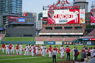 Members of the St. Louis Cardinals celebrate after defeating the Milwaukee Brewers in a baseball game to earn a playoff birth Sunday, Sept. 27, 2020, in St. Louis. (AP Photo/Jeff Roberson)