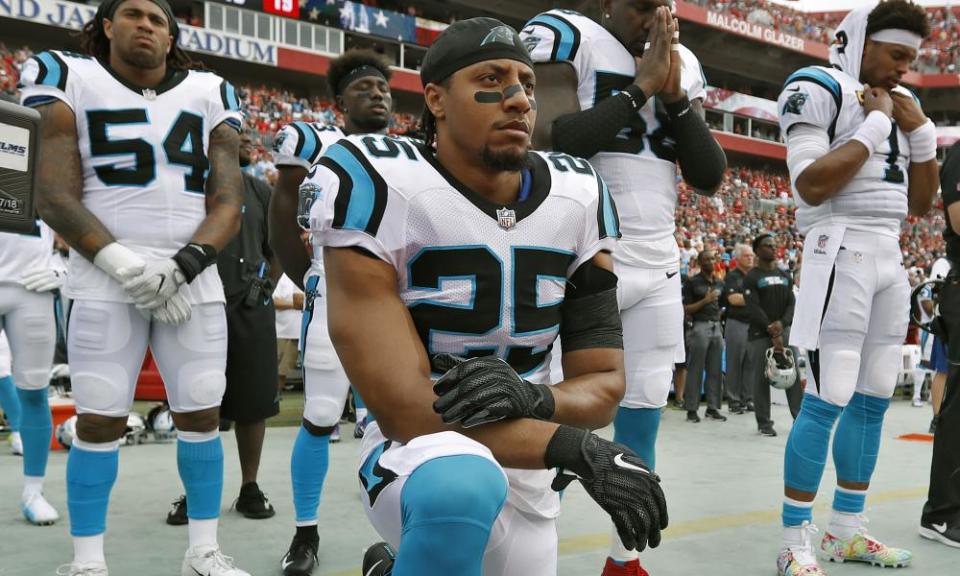 Eric Reid kneels during the national anthem earlier this month