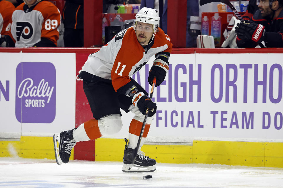 Philadelphia Flyers' Travis Konecny (11) moves the puck up the ice against the Carolina Hurricanes during the third period of an NHL hockey game in Raleigh, N.C., Wednesday, Nov. 15, 2023. (AP Photo/Karl B DeBlaker)